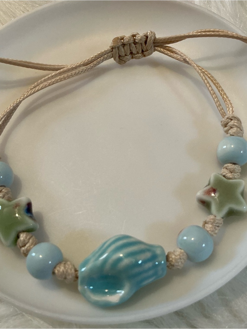 Blue conch shell and green stars beige string bracelet